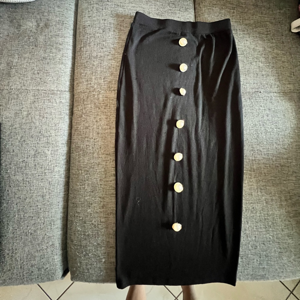 Black ribbed pencil skirt with pearl buttons trimmed in gold